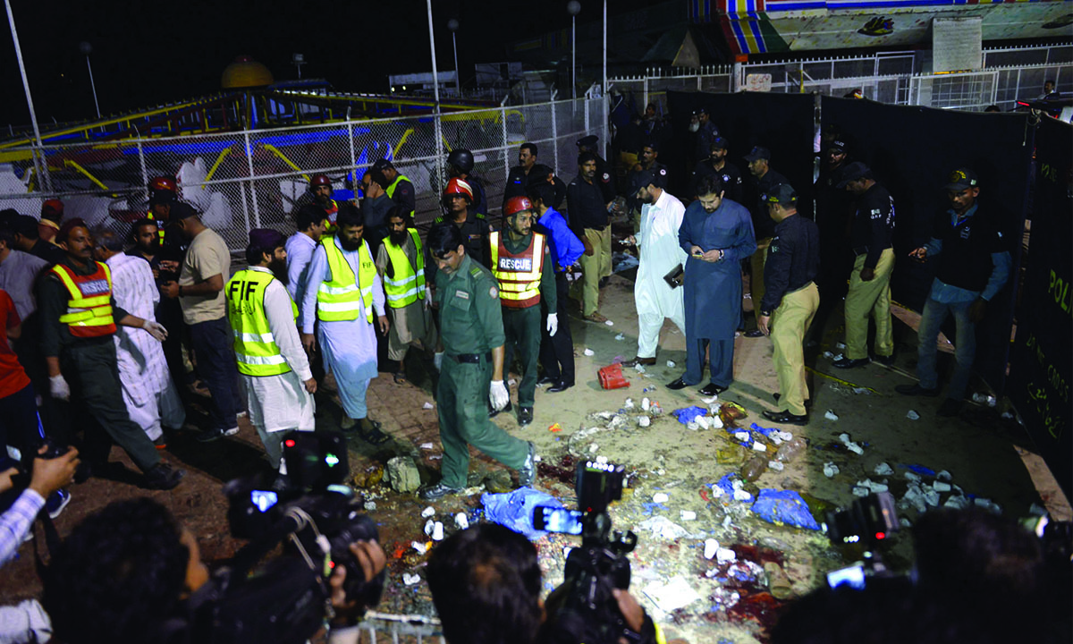 Rescue workers, officials and journalists gather at a bomb blast site in Lahore on March 27, 2016 Credit: M. Arif, White Star