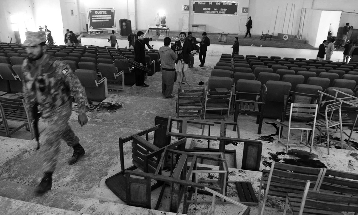 Journalists gather in the auditorium of the Army Public School in Peshawar after the massacre on 16 December, 2014. Credit: Abdul Majeed Goraya, White Star.