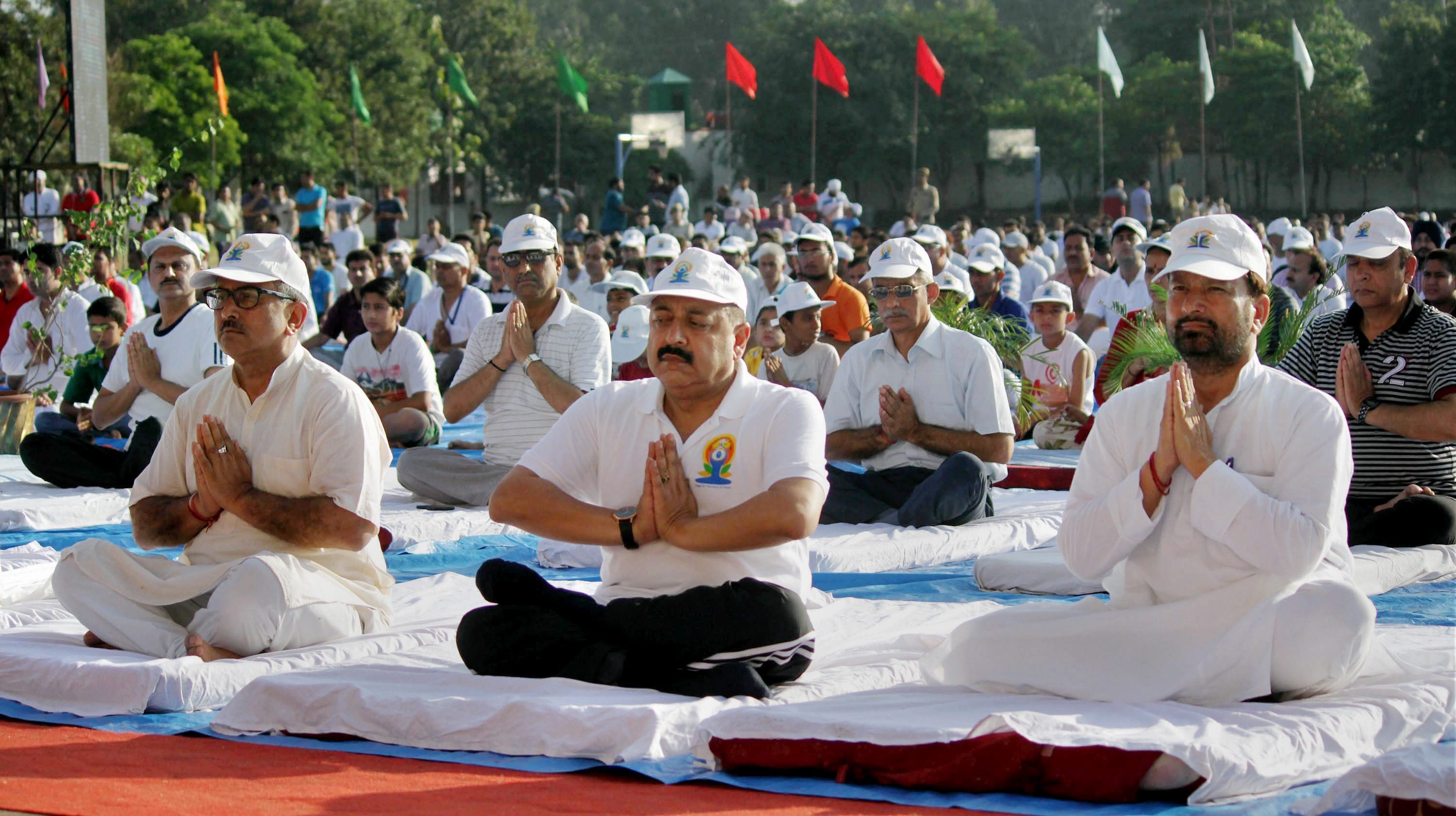 Jammu: Minister of State (MoS) in PMO Jitender Singh, Dy.Chief Minister Nirmal Singh and others perform Yoga during a mass yoga session on the International Day of Yoga 2015 in Jammu on Sunday. Credit: PTI Photo