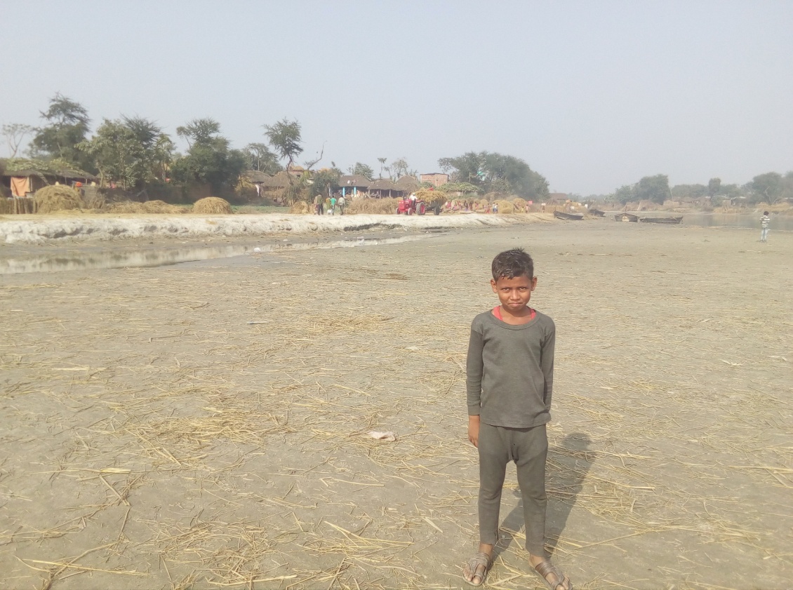 A boy standing near a river channel in Saharsa district, Bihar. Credit: Ranjeet Kumar Sahani